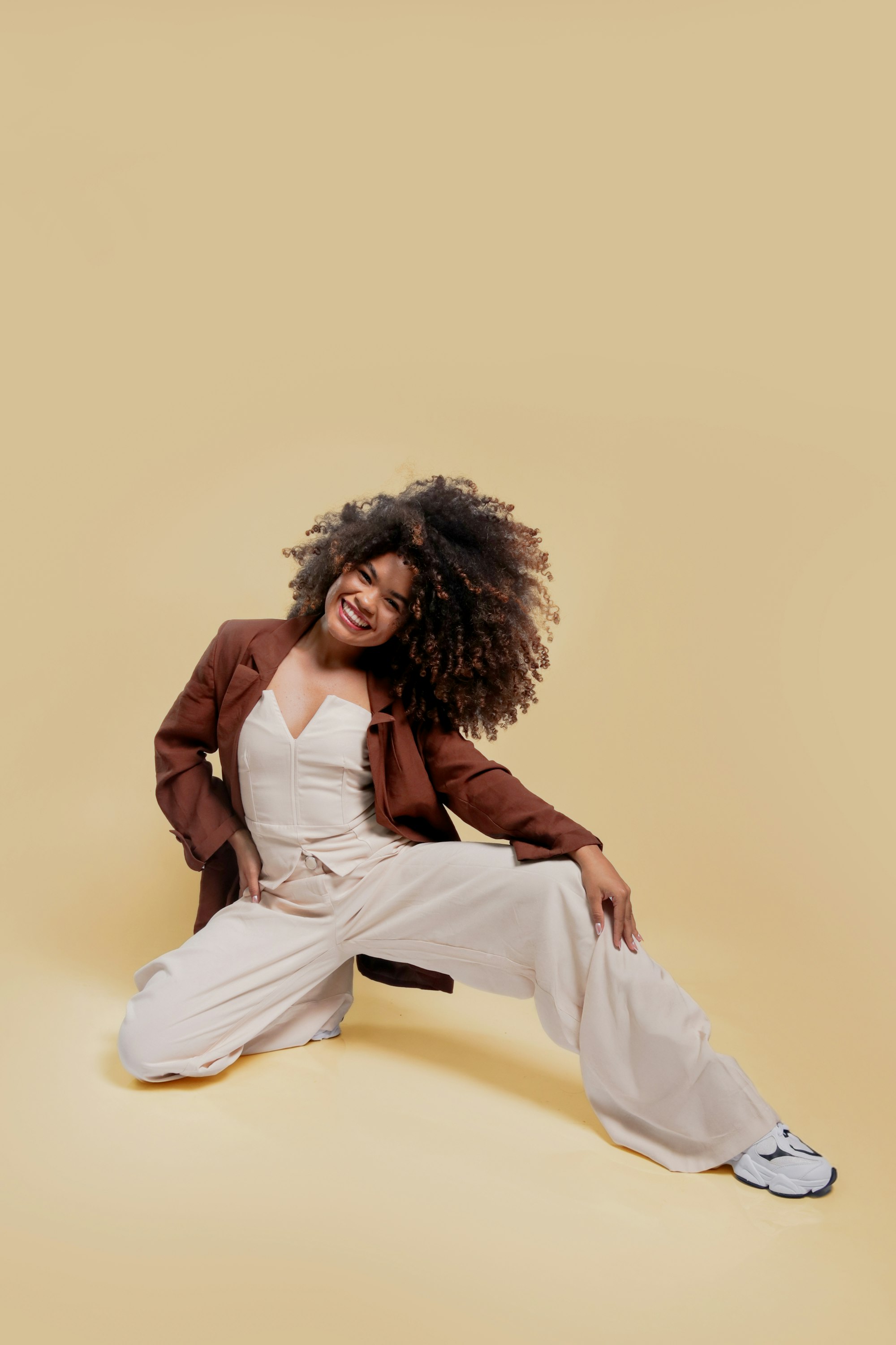 CHICYA editorial campaign — bold fashion on a cream backdrop